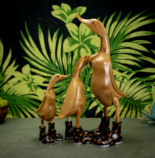 Hand Carved, Hand Painted Wooden Sculpture of a Duck in Shiny Black Boots with Flowers