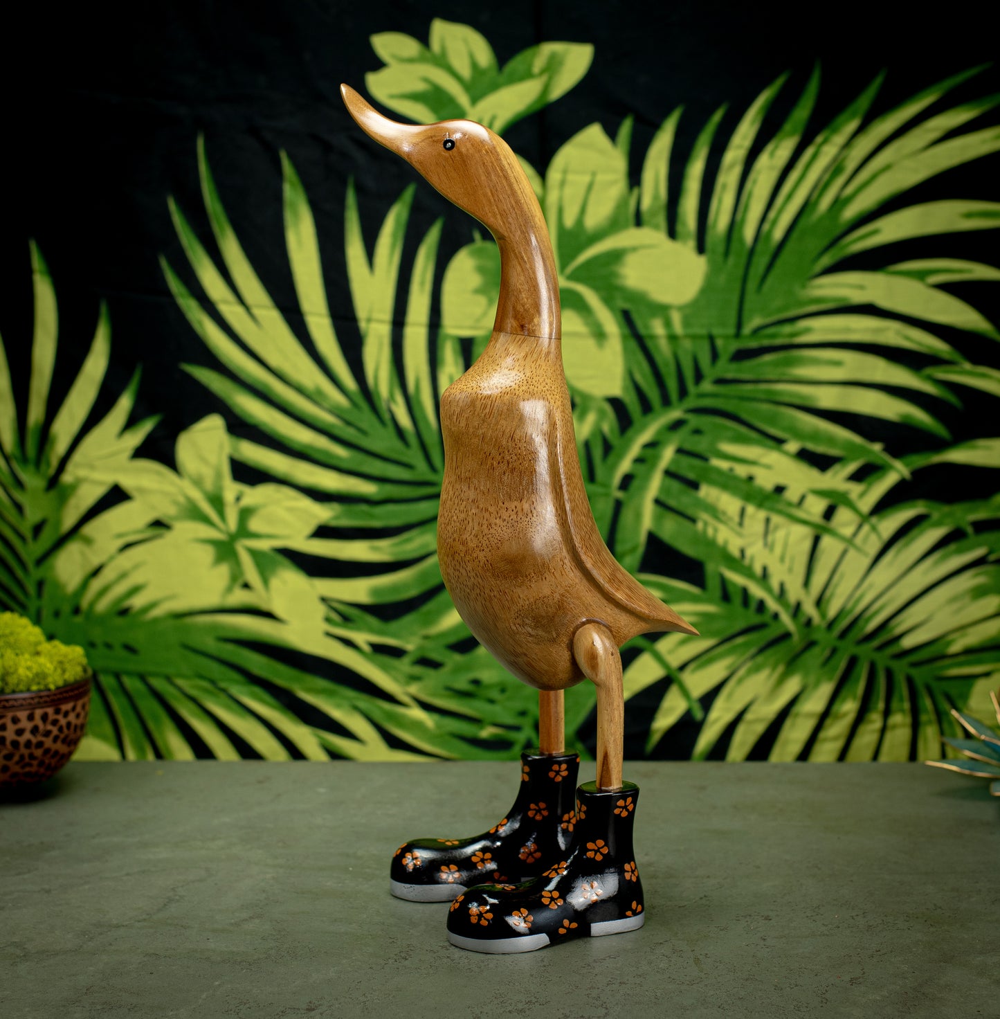 Hand Carved, Hand Painted Wooden Sculpture of a Duck in Shiny Black Boots with Flowers