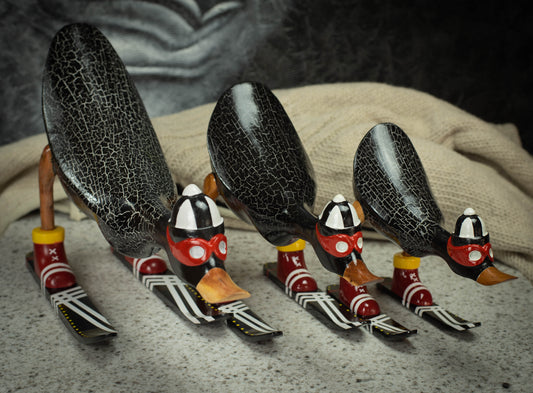 Hand Carved, Hand Painted Wooden Sculpture of a Black Duck on Skis
