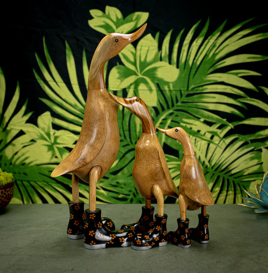 Hand Carved, Hand Painted Wooden Sculpture of a Duck in Shiny Black Boots with Flowers