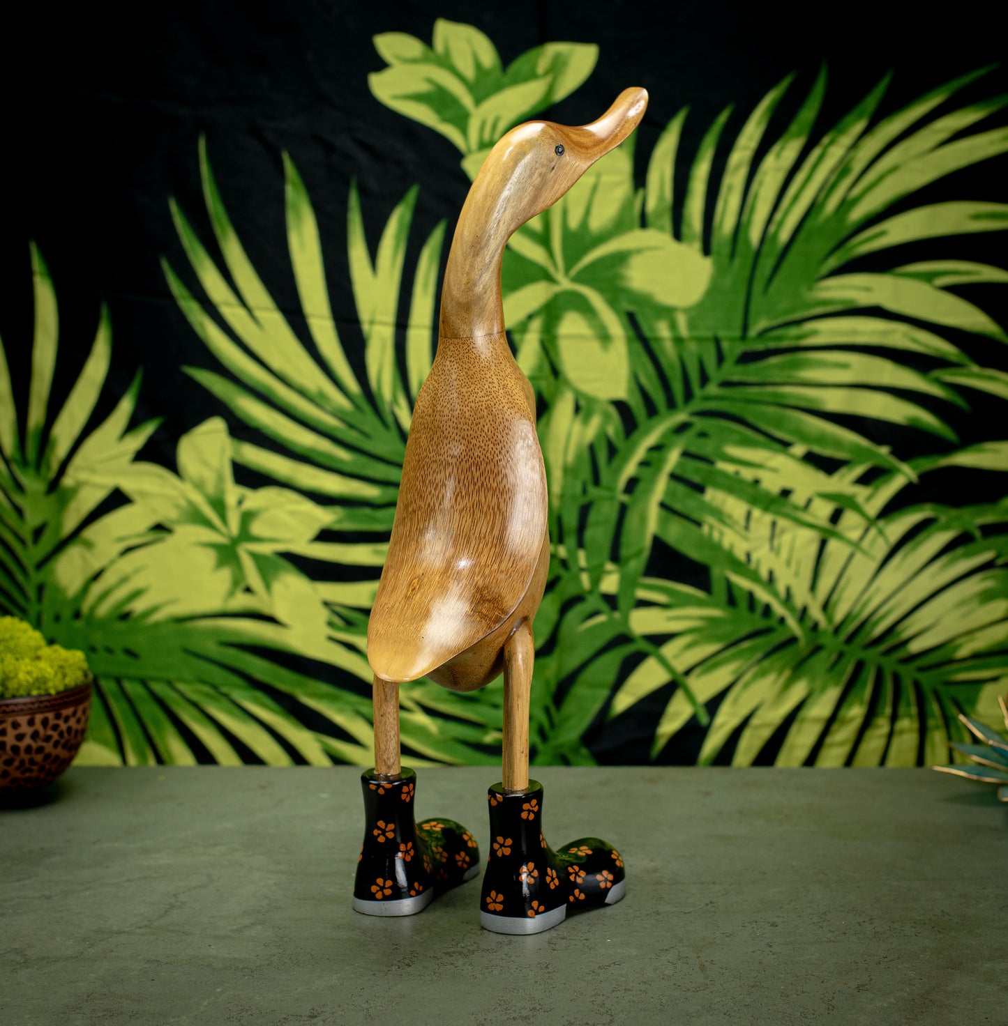 Hand Carved, Hand Painted Wooden Sculpture of a Duck in Shiny Black Boots with Flowers