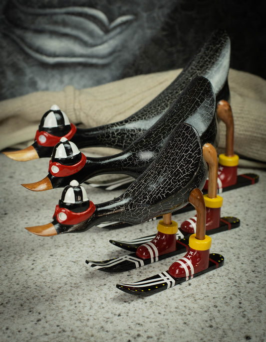 Hand Carved, Hand Painted Wooden Sculpture of a Black Duck on Skis